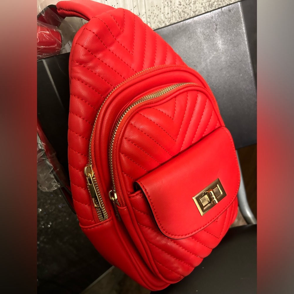 Red, quilted crossbody, Gold Hardwaremini backpack Caleesa Los Angeles.